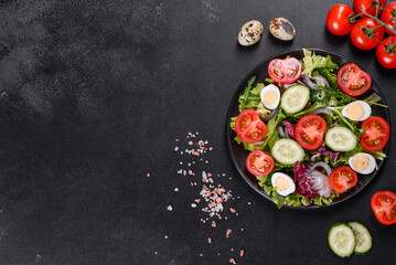 Fototapeta na wymiar Fresh delicious vegitarian salad of chopped vegetables on a plate