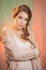 Fototapeta premium Portrait of beautiful angelic look young woman in studio