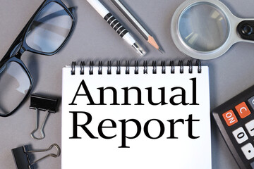 annual report, text on white paper on gray background