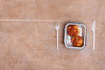 healthy food delivery and roasted curd cheese pancake in takeaway lunch box