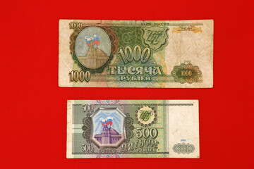 Fototapeta na wymiar Russian paper money on a red background
