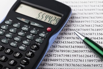 Calculator and Pen on Numbers