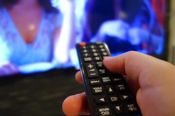 tv remote in front of TV
