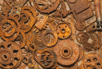 Industrial background. Heap of old rusty parts