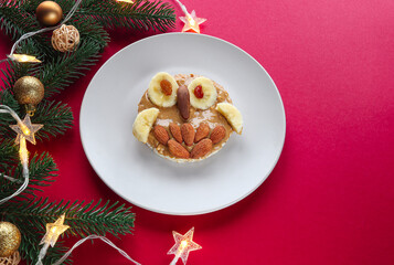 Christmas funny breakfast idea for kids. An owl-shaped peanut butter banana sandwich.