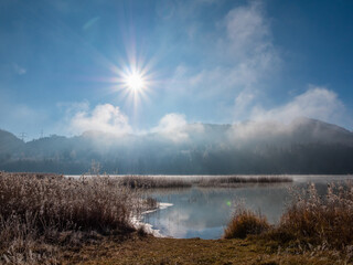Weissensee with fog and mountains