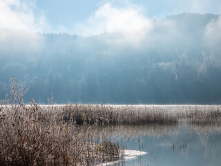 Weissensee with fog and mountains