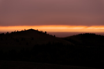 Beautiful morning sunrise landscape over Carpathian mountain with amazing orange sky