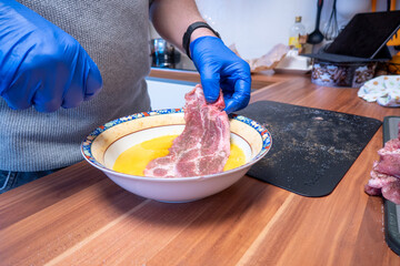 one  cutlet is breaded with egg