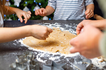 christmas and new year holidays, mom and children prepare gingerbread cookies