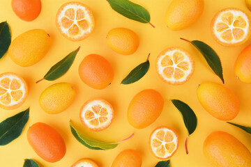 Fototapeta na wymiar Fresh ripe kumquat fruits, colorful bright orange citrus background 