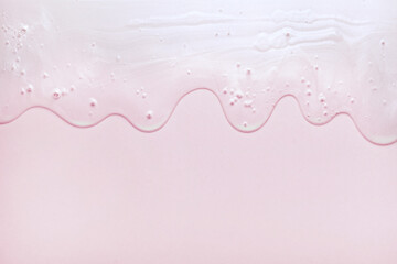 Cream pink transparent cosmetic sample texture with bubbles background