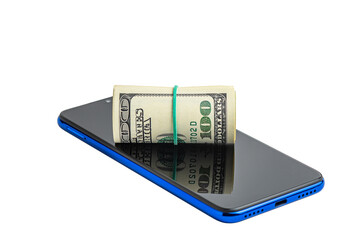 Roll of dollar bills tied with an elastic band and a mobile phone on a white background.