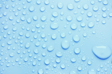 Cosmetic moisturizing liquid drops on green blue pastel background. Toner or lotion. Hyaluronic serum