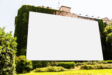 Blank billboard on building for outdoor advertising in Milano, Italy.