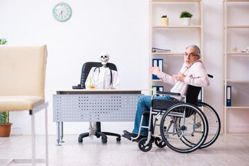 Old man in wheel-chair visiting dead doctor