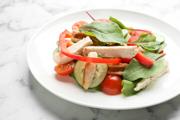 Delicious fresh chicken salad served on white marble table, closeup