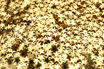 Confetti stars as background, closeup. Christmas celebration