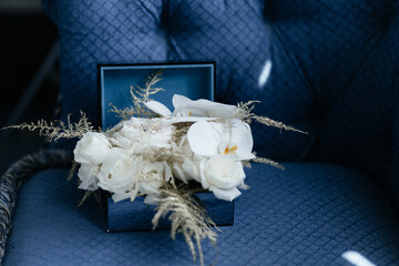 White flowers in the blue box. Wedding bouquet. Decorations