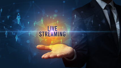 Elegant hand holding LIVE STREAMING inscription, social networking concept