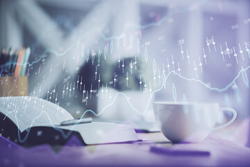 Multi exposure of forex graph drawing and desktop with coffee and items on table background. Concept of financial market trading