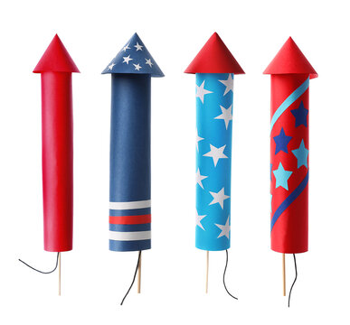 Set of bright firework rockets isolated on white
