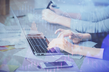 Multi exposure of woman hands typing on computer and financial chart hologram drawing. Stock market analysis concept.