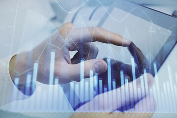 Multi exposure of man's hands holding and using a phone and financial chart drawing. Market analysis concept.