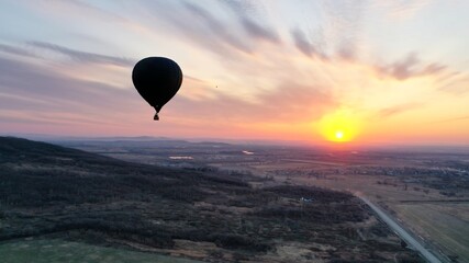 Balloon in morning sky with sunrise