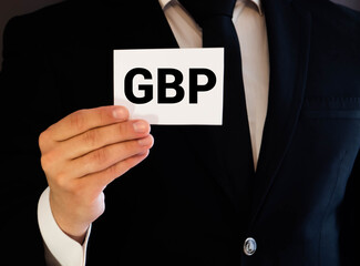 GBP acronym British Pound on white sticky note
