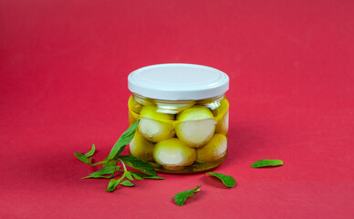 Labneh balls Jar| Traditional Lebanese Breakfast Dairy Food yoghurt Scoops with olive oil beside mint and thyme leaves