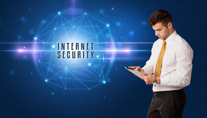 Businessman thinking about security solutions with INTERNET SECURITY inscription