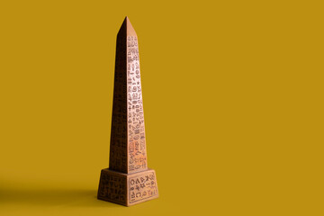 Egyptian obelisk with yellow background, symbol of power