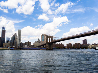 Fototapeta na wymiar Brooklyn Bridge on cloudy summer day in New York City
