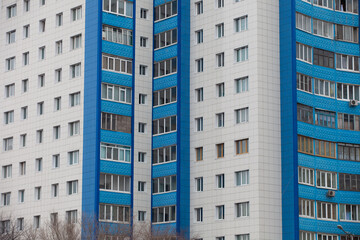 Fototapeta premium Autumn, 2013 - Vladivostok, Primorsky region - High-rise residential buildings. Multi-colored residential buildings. Windows in residential high-rise buildings.