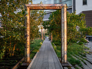 Decorated door frames art in path on The High Line in Chelsea, Manhattan, New York City