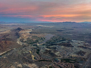 Aerial sunrise view of city edge of Las Vegas, Nevada on cloudy day