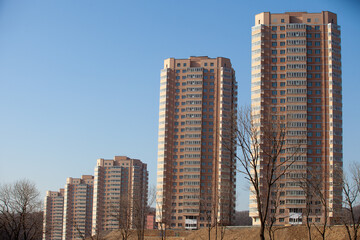 Fototapeta premium Autumn, 2013 - Vladivostok, Primorsky region - High-rise residential buildings. Multi-colored residential buildings. Windows in residential high-rise buildings.