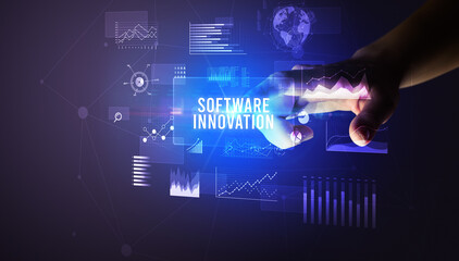 Hand touching SOFTWARE INNOVATION inscription, new business technology concept