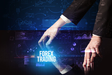 Businessman touching huge screen with FOREX TRADING inscription, cyber business concept