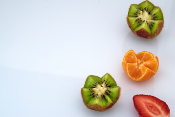 Fresh fruit strawberry, kiwi, nectarine legate on a white background.Space for text. - obrazy, fototapety, plakaty