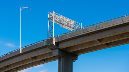 Bridge of the Quebec 440 Highway above Saint-Roch, Quebec city, under a blue sky.
