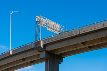 Bridge of the Quebec 440 Highway above Saint-Roch, Quebec city, under a blue sky.