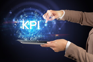 Close-up of a touchscreen with KPI abbreviation, modern technology concept