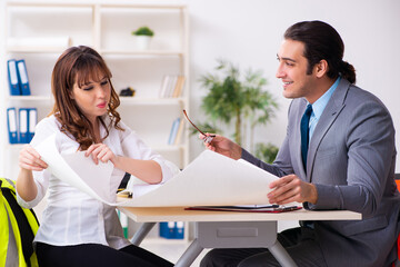 Fototapeta premium Young businessman and female architect discussing new project