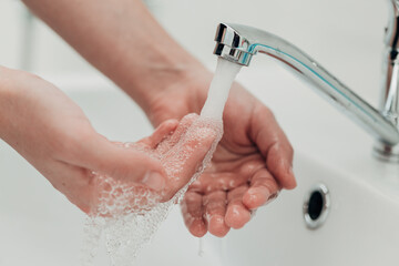 The Girl Washes Her Hands to Avoid Infection With the Virus COVID-19
