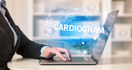 Doctor working a health check with CARDIOGRAM inscription, recording medical test results
