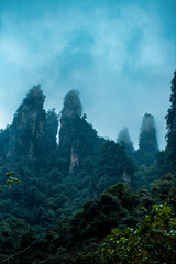 Amazing landscape of mountain and forest in the foggy at Wulingyuan, Hunan, China. Wulingyuan Scenic and Historic Interest Area which was designated a UNESCO World Heritage Site in China