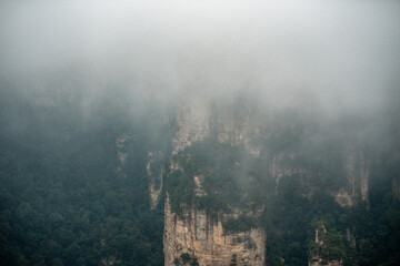 the mountain and forest in foggy at at Wulingyuan. Wulingyuan Scenic and Historic Interest Area which was designated a UNESCO World Heritage Site as well as an AAA scenic area in china.