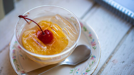 Orange In Syrup With Sweet Cherry